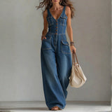 Woman wearing a relaxed-fit denim jumpsuit in a classic wash