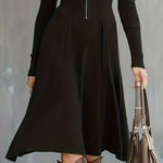 Woman wearing a zip-front long-sleeve stretch dress
