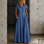 Woman wearing a long shirt-style denim dress