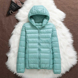 Mint green lightweight padded jacket with a feminine fit