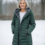 Woman wearing a fleece-lined quilted padded jacket with a shaped waist