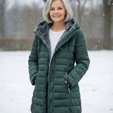 Woman wearing a fleece-lined quilted padded jacket with a shaped waist