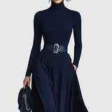 Woman wearing a high-neck A-line maxi dress