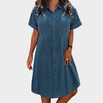 Woman wearing a lightweight denim button-through shirt dress
