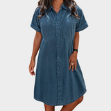 Woman wearing a lightweight denim button-through shirt dress