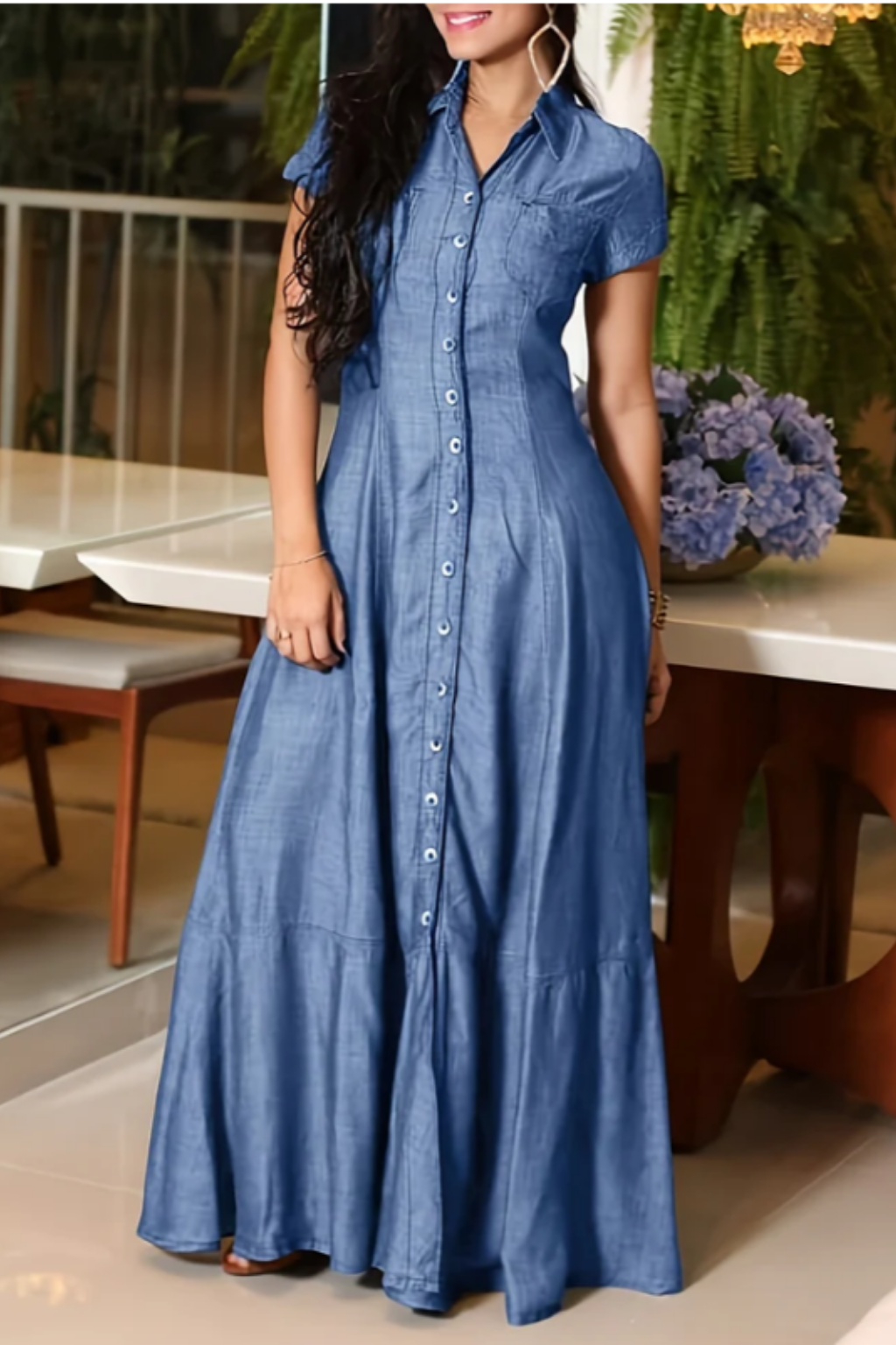 Woman wearing a long shirt-style denim dress