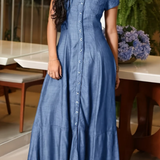 Woman wearing a long shirt-style denim dress
