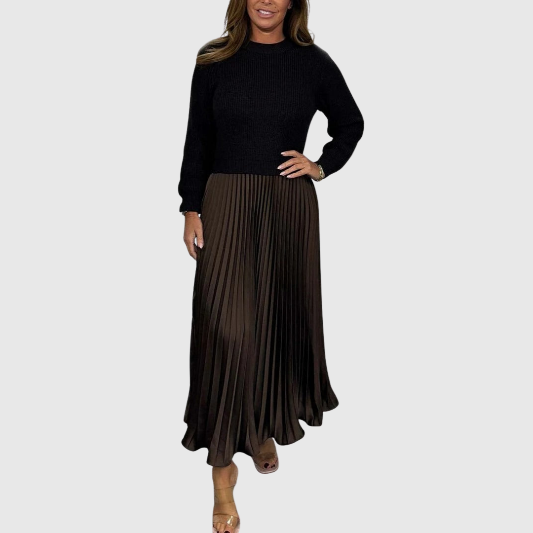 Woman wearing a maxi dress with a knit-look bodice and pleated skirt