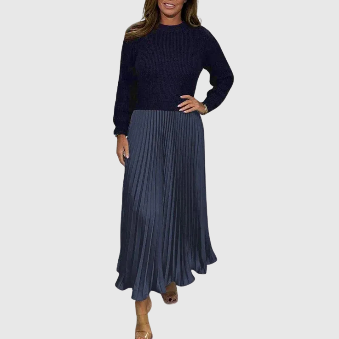 Woman wearing a maxi dress with a knit-look bodice and pleated skirt