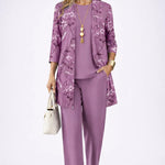 Woman wearing a patterned three-piece cardigan set with wide-leg trousers