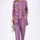 Woman wearing a patterned three-piece cardigan set with wide-leg trousers