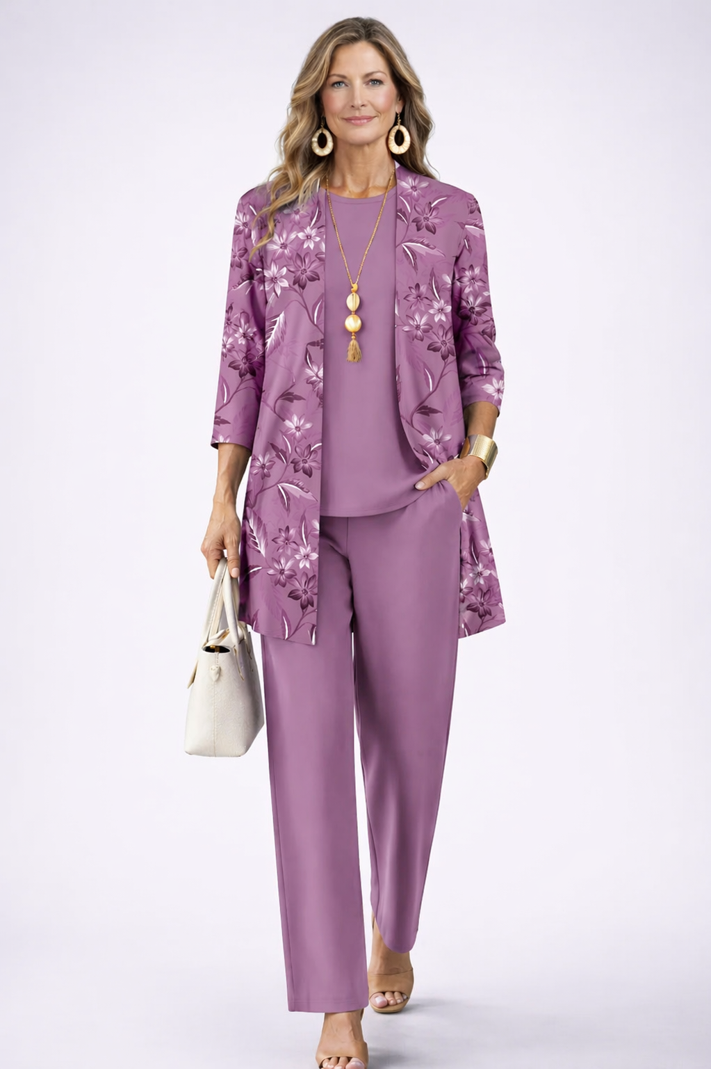 Woman wearing a purple three-piece cardigan set with wide-leg trousers