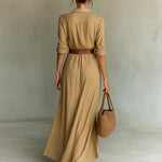Woman wearing a wrap-style maxi dress with belt