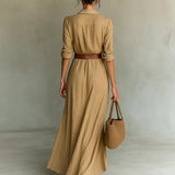 Woman wearing a wrap-style maxi dress with belt