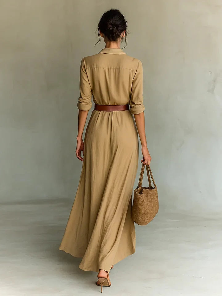 Woman wearing a wrap-style maxi dress with belt