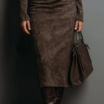 Woman wearing a suede-effect high-neck midi dress