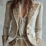 Woman wearing an ivory embroidered blazer
