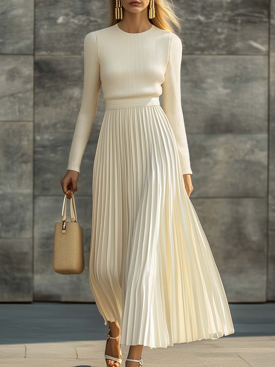 Woman wearing a knitted satin dress with pleated skirt