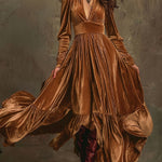 Woman wearing a deep V-neck pleated maxi dress