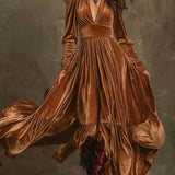 Woman wearing a deep V-neck pleated maxi dress