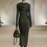 Woman wearing a long-sleeve hooded tunic dress with zip detail