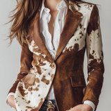 Woman wearing a vintage cow print blazer