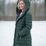 Woman wearing a fleece-lined quilted padded jacket with a shaped waist