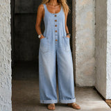 Woman wearing a sleeveless washed cotton jumpsuit with square neckline