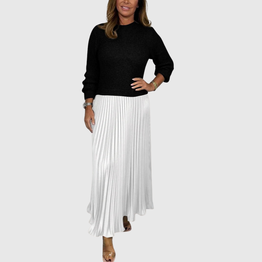 Woman wearing a maxi dress with a knit-look bodice and pleated skirt