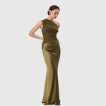 Woman wearing a one-shoulder satin maxi dress