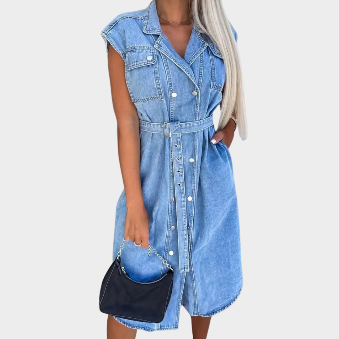 Woman wearing a sleeveless denim dress with a matching belt