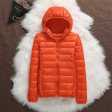 Orange lightweight padded jacket with a feminine fit