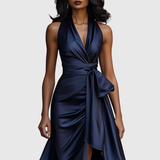 Woman wearing an evening wrap maxi dress with high slit
