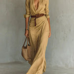 Woman wearing a wrap-style maxi dress with belt