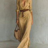 Woman wearing a wrap-style maxi dress with belt