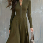 Woman wearing a zip-front long-sleeve stretch dress