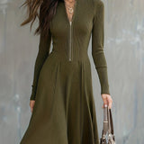 Woman wearing a zip-front long-sleeve stretch dress