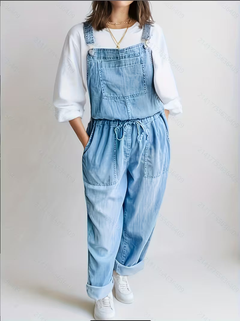 Woman wearing a loose-fit denim jumpsuit in a classic wash