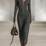 Woman wearing a long-sleeve hooded tunic dress with zip detail