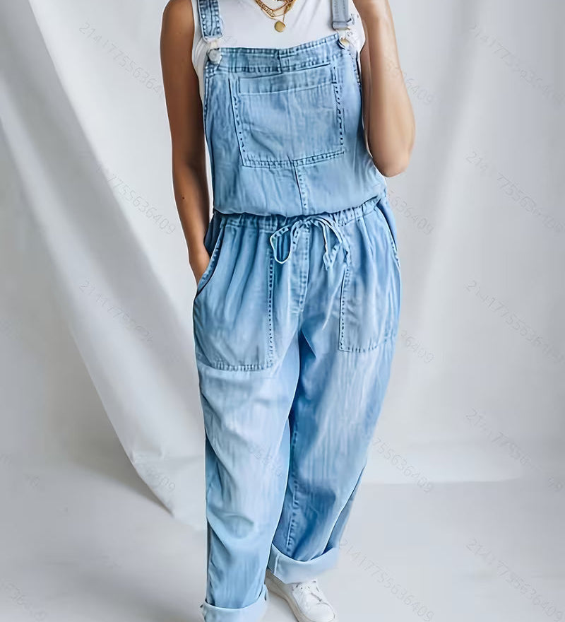 Woman wearing a loose-fit denim jumpsuit in a classic wash