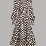 Woman wearing a rhombus print dress with belted waist