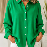 Woman wearing a blush pink relaxed button-front blouse