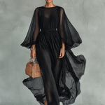 Woman wearing a statement sleeve pleated midi dress
