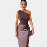 Woman wearing a one-shoulder satin maxi dress