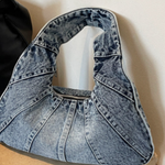 Woman carrying a casual shoulder bag