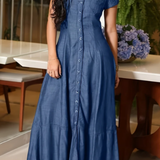 Woman wearing a long shirt-style denim dress