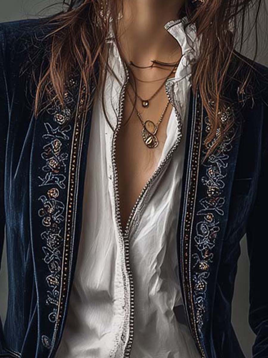 Woman wearing a long embroidered velvet jacket