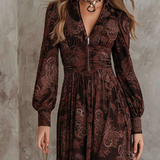 Woman wearing a paisley print zip-waist maxi dress