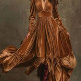 Woman wearing a deep V-neck pleated maxi dress