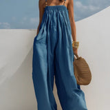 Woman wearing a wide-leg denim jumpsuit